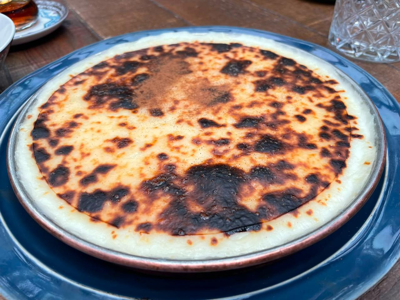 A baked milk dessert with a caramelized top is served as part of the Bursa menu at Zennup 1844 in Bursa, Türkiye. (Photo by Koray Erdogan/Türkiye Today)