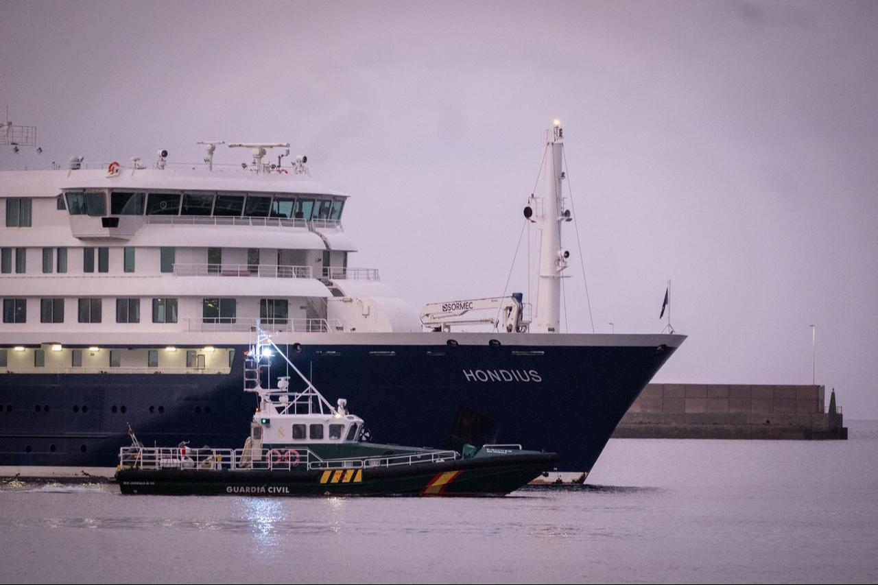The cruise ship Hondius, carrying suspected hantavirus cases, approaches the Port of Granadilla as a Spanish Civil Guard vessel escorts it off the coast of Tenerife, Canary Islands, Spain, May 10, 2026. (AA Photo)