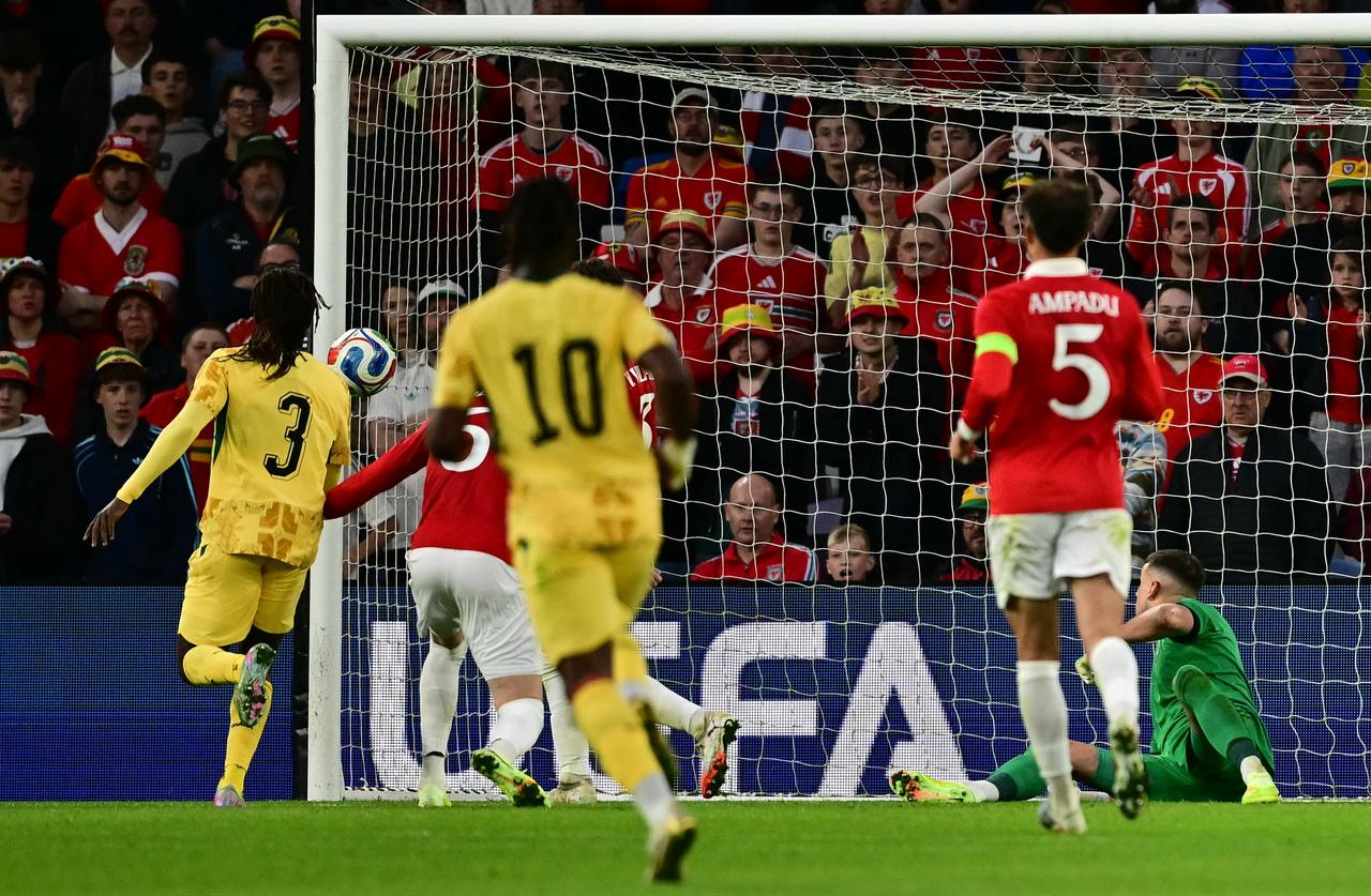 Ghana's defender #03 Caleb Yirenkyi (L) scores the opening goal during the international friendly football match between Wales and Ghana ahead of the 2026 FIFA World Cup football tournament, at Cardiff City Stadium, in Cardiff, June 2, 2026. (AFP Photo)