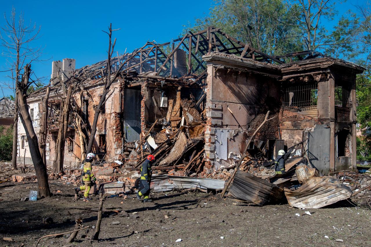 Ukrainian rescuers work by a damaged building following an air attack in Dnipro on June 2, 2026, amid the Russian invasion of Ukraine. (AFP Photo)