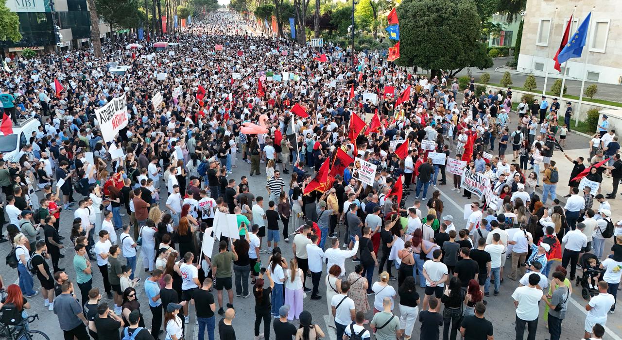 An aerial view of thousands of demonstrators carrying banners and placards gather at Skanderbeg Square as they gather to protest the planned sale of a beach in the Zvernec area of Vlora as part of a tourism development project, in Tirana, Albania on June 2, 2026. (AA Photo)