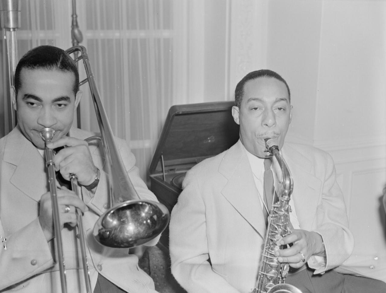 Duke Ellington Orchestra musicians Lawrence Brown and Johnny Hodges perform at the Turkish ambassador’s residence in Washington, D.C., U.S. (Photo by William P. Gottlieb/Library of Congress)