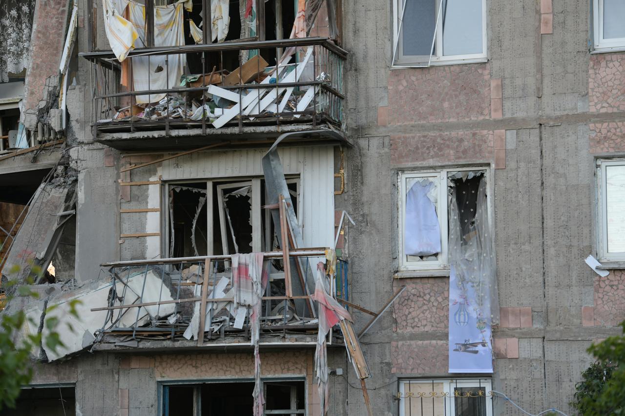 A view taken on June 24, 2026 shows a heavily damaged multi-storey apartment building following a recent attack, which local Russian-installed officials called a Ukrainian drone strike, in the town of Gorlivka in the Donetsk region, Russian-controlled Ukraine. (AFP Photo)