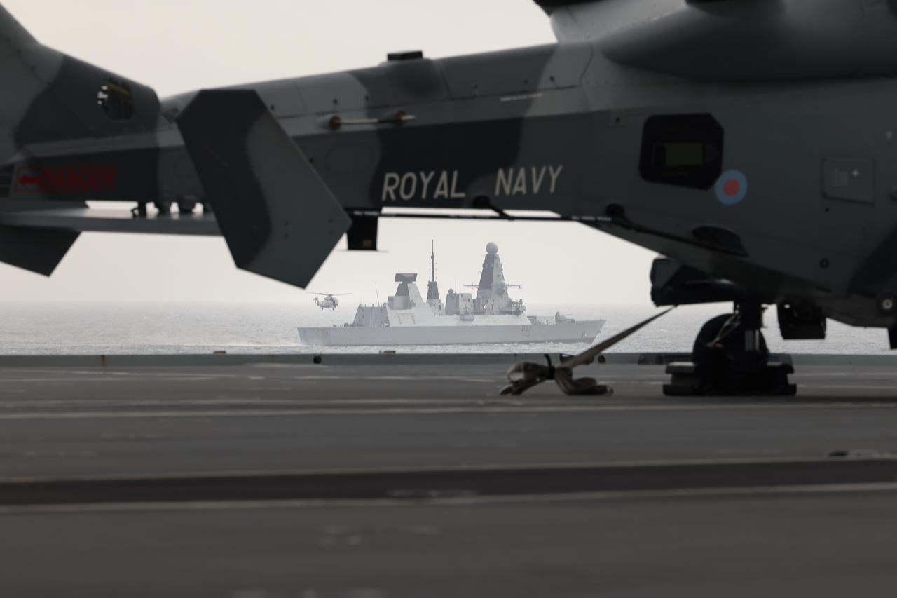 UK Royal Navy's Merlin helicopter delivering cargo to HMS Duncan from HMS Prince of Wales, 18 Jun 2026. (UK MOD © Crown copyright 2026)