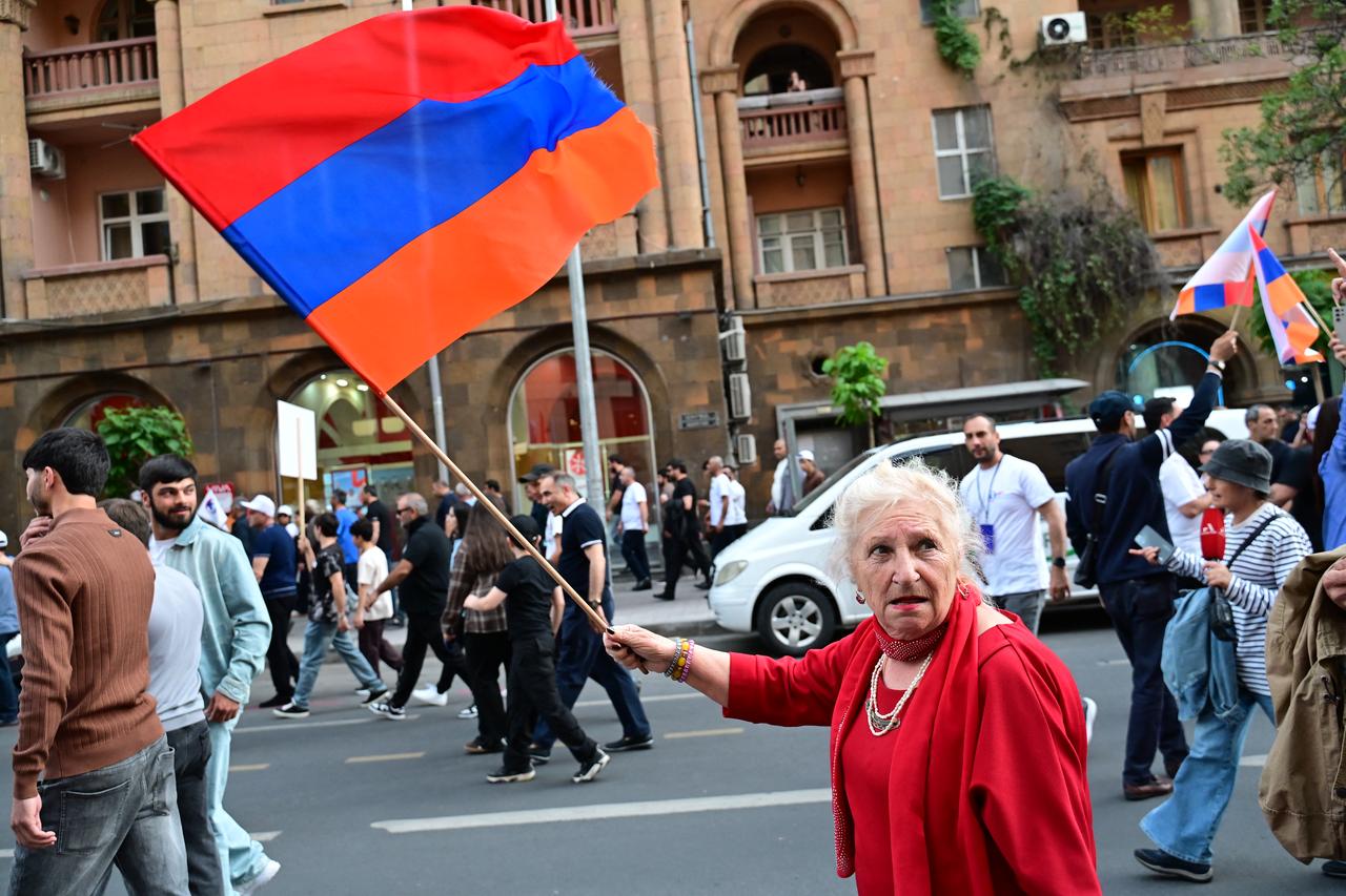Supporters of Strong Armenia, the party of billionaire Russian-Armenian businessman Samvel Karapetyan - who is under house arrest on charges of plotting a coup, stage a campaign march in Yerevan on June 3, 2026. (AFP Photo)