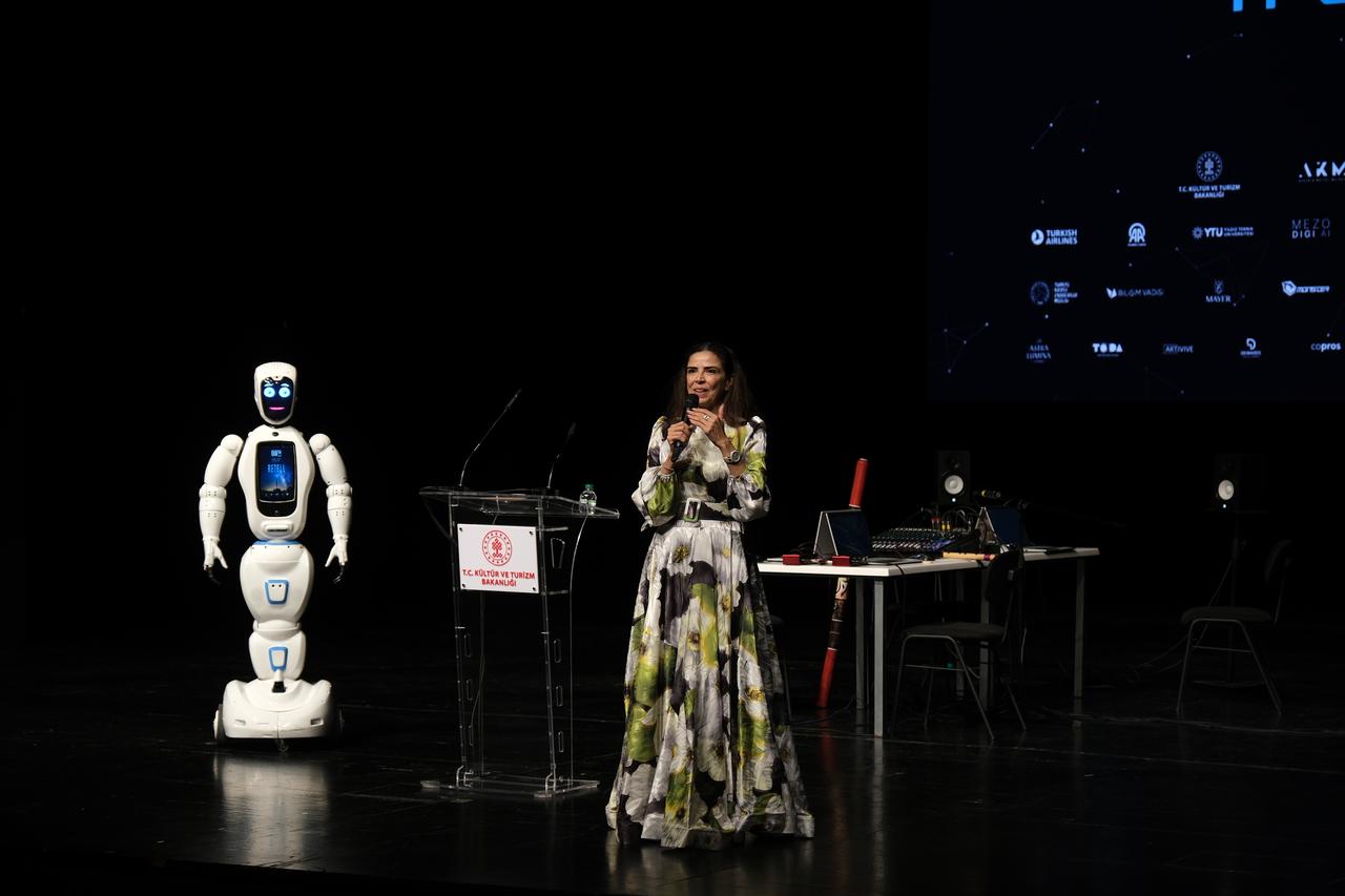 Festival Director Nabat Garakhanova speaks during the opening ceremony of the 6th Istanbul Digital Art Festival, accompanied by Ada Robot. (Photo via Mezo)