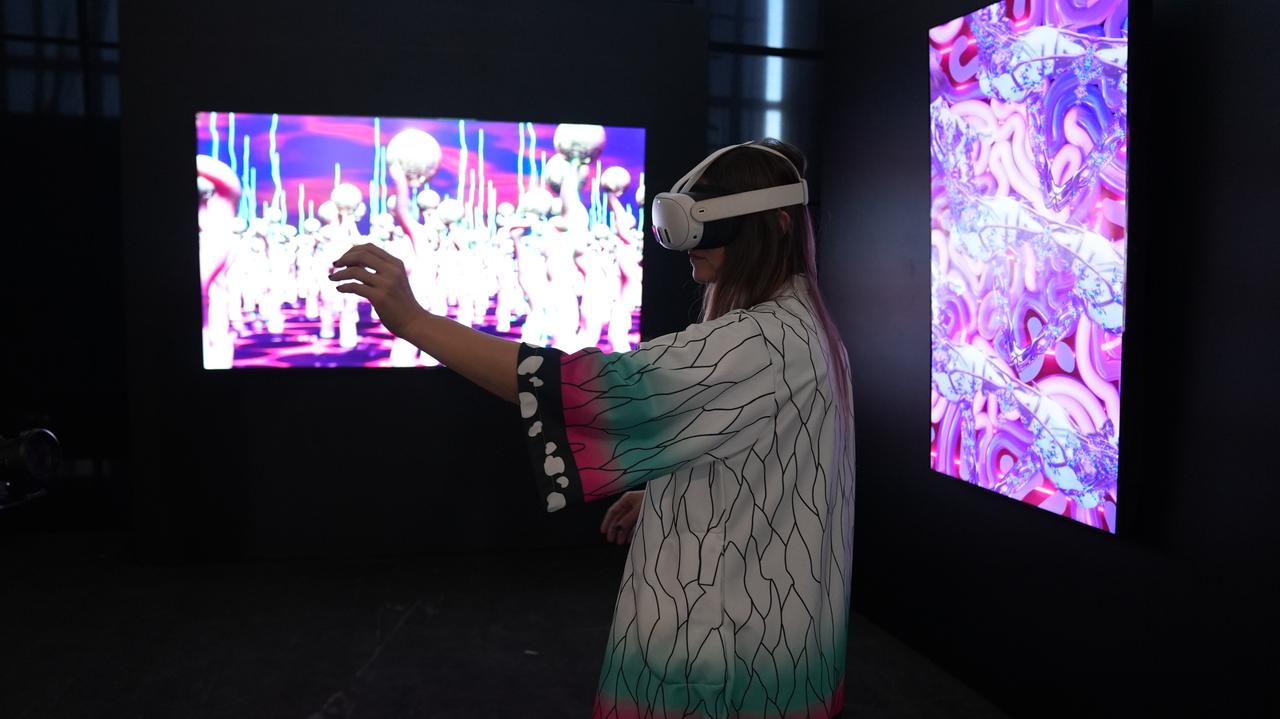 A visitor experiences a VR-based digital artwork at the 6th Istanbul Digital Art Festival at Ataturk Cultural Center, Istanbul, Türkiye. (Photo via Mezo)