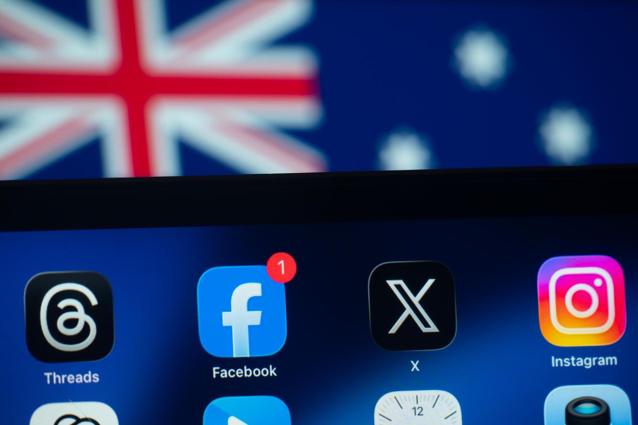 close up of an iPad screen displaying the social media app against Australian flag. (Photo via Adobe Stock)