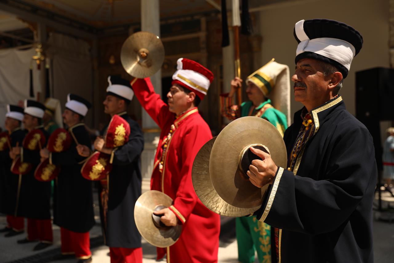 Members of the mehter band carry ceremonial standards during a traditional Ottoman military music performance at Topkapi Palace in Istanbul, Türkiye. (AA Photo)