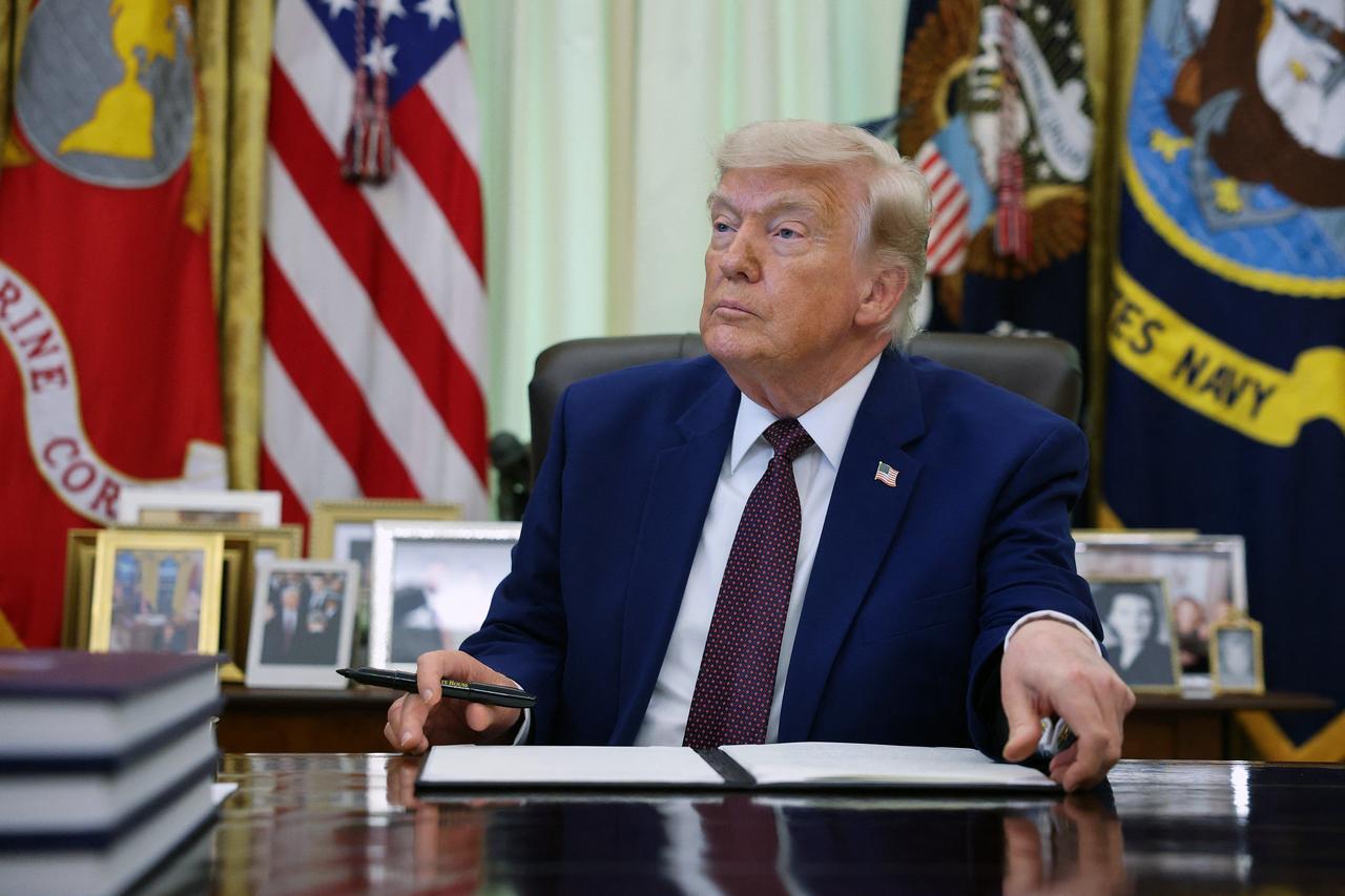 U.S. President Donald Trump prepares to sign an executive order during an event in the Oval Office of the White House, June 3, 2026 in Washington, DC. (AFP Photo)
