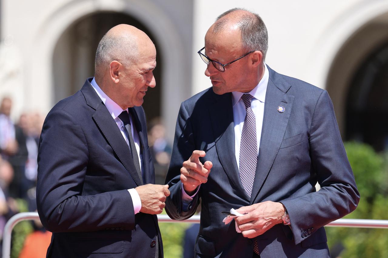 Slovenian Prime Minister Janez Jansa (L) and German Chancellor Friedrich Merz speak after posing for a family picture as part of the EU-Western Balkans Summit at Porto Montenegro in Tivat, Montenegro, June 5, 2026. (AFP Photo)
