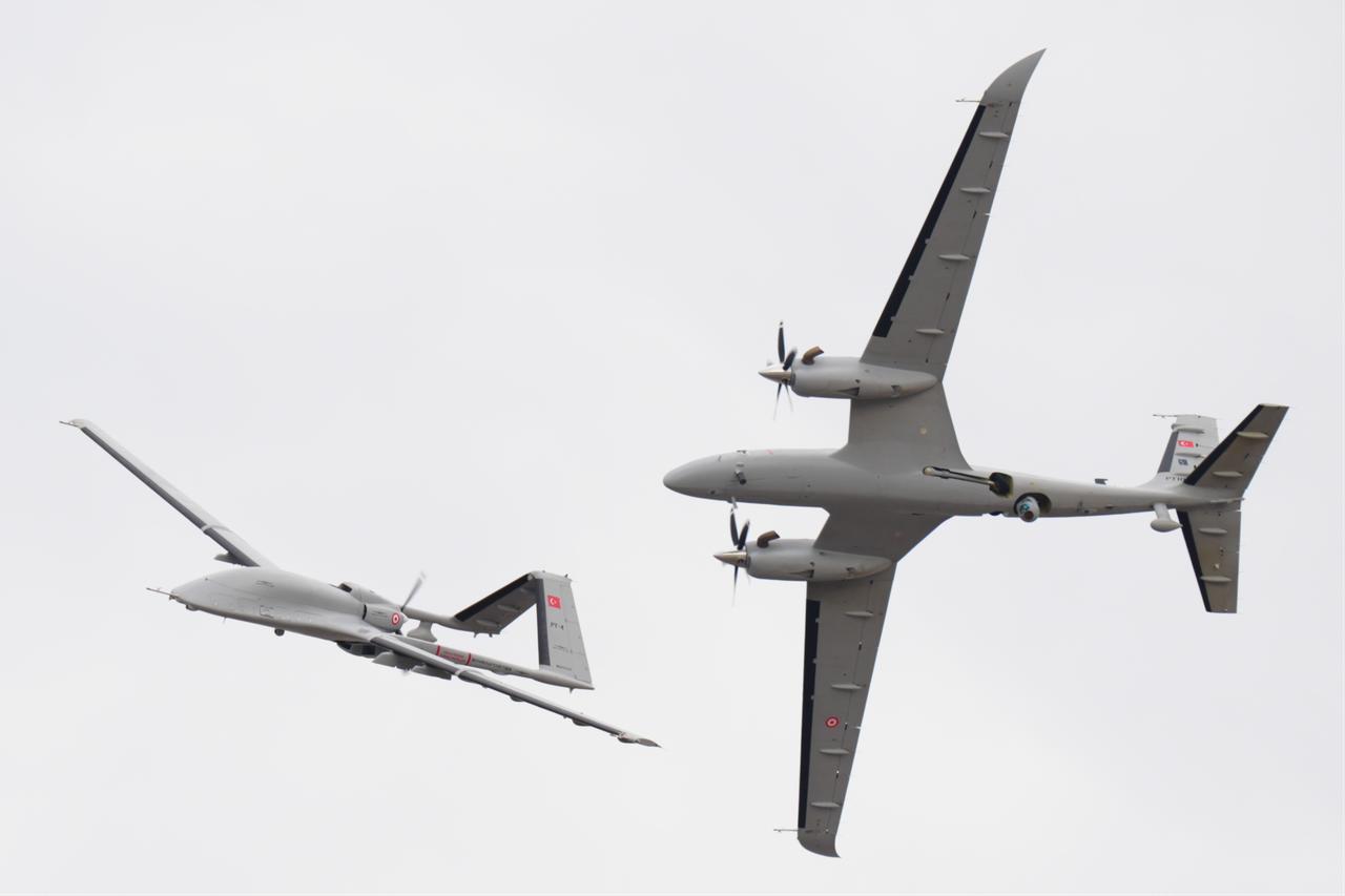 Turkish unmanned aerial vehicles Bayraktar Akinci (R) and Bayraktar TB3 (L) perform during the opening day of TEKNOFEST at Istanbul Ataturk Airport in Istanbul, Türkiye, Sept. 17, 2025. (AA Photo)