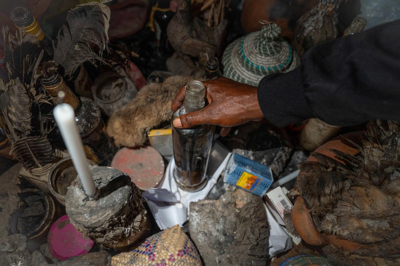 Dauda Tshimanga holds a bottle of traditional medicine in his laboratory in Bunia, DR Congo, on June 2, 2026. (AFP Photo)