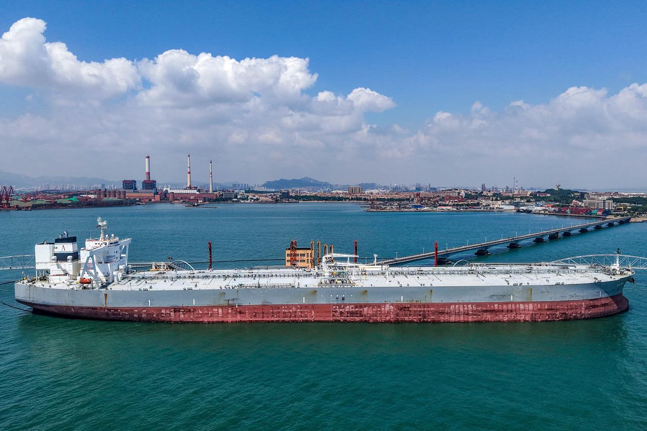 Oil wavers, Asian stocks hit by profit-taking and weaker chip outlook