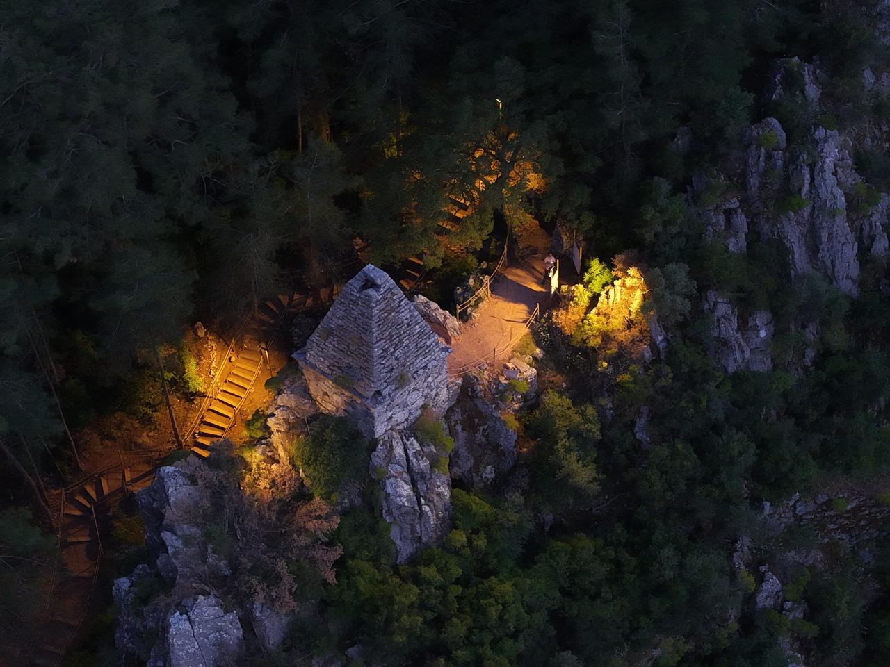 Diagoras’s Pyramid Tomb 'known as the only well-preserved pyramid-roofed monumental tomb surviving in Türkiye' has been made ready to welcome visitors at night following the completion of lighting works in Mugla, Türkiye, June 5, 2026. (IHA Photo)