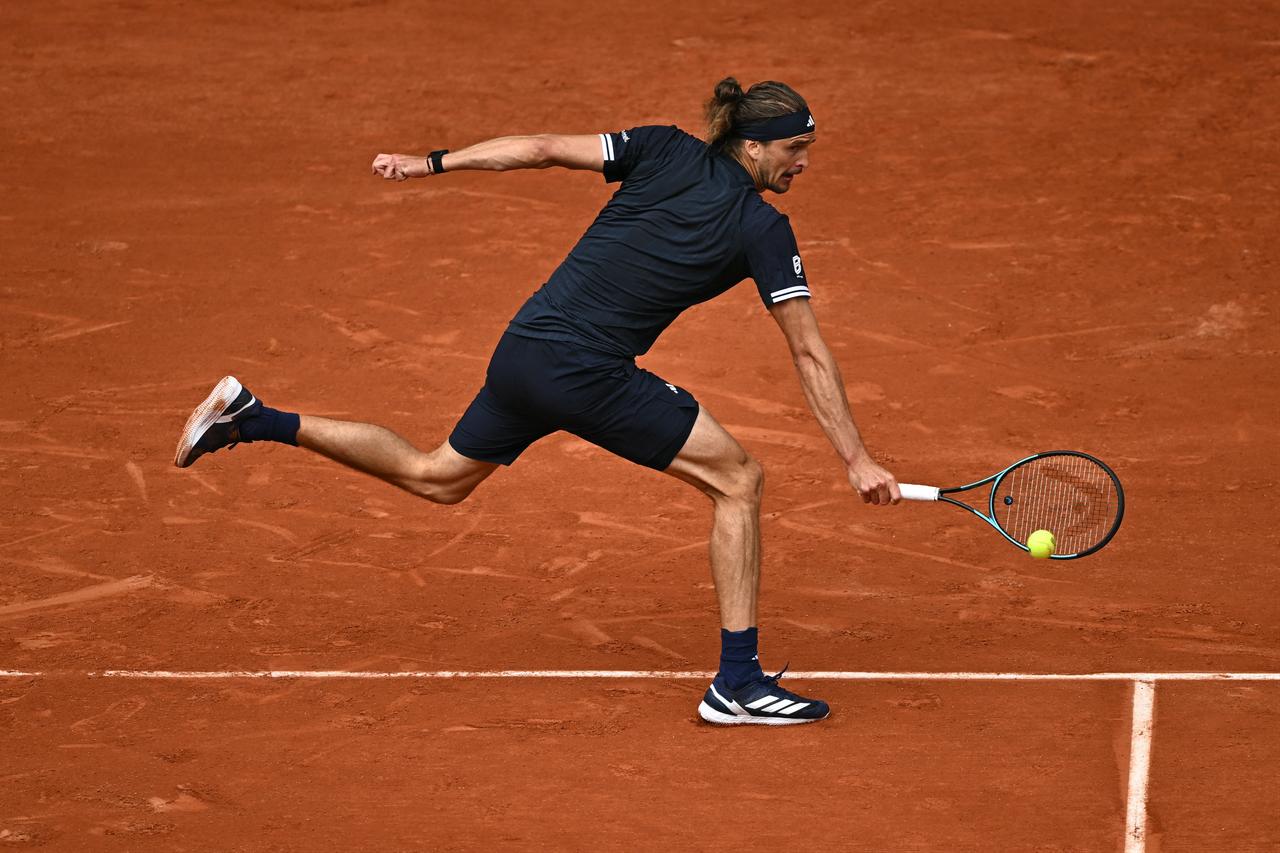 Germany's Alexander Zverev plays a backhand return to Czech Republic's Jakub Mensik during their men's semi final singles match on day 13 of the French Open tennis tournament on Court Philippe-Chatrier at the Roland-Garros Complex in Paris, June 5, 2026. (AFP Photo)