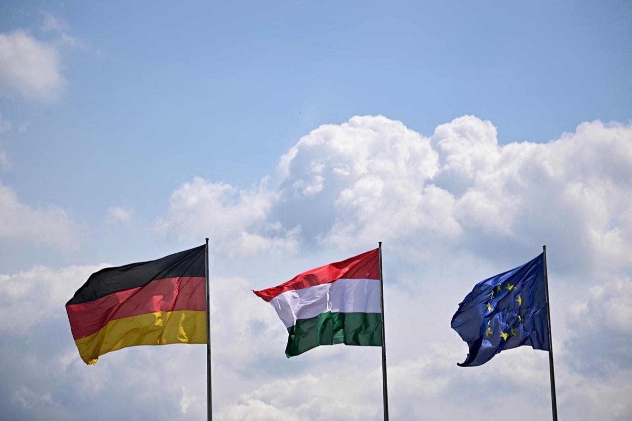 The flags of (L-R) Germany, Hungary, and the European Union (EU) fly in the wind in front of the German Chancellery in Berlin, on June 2, 2026. (AFP Photo)