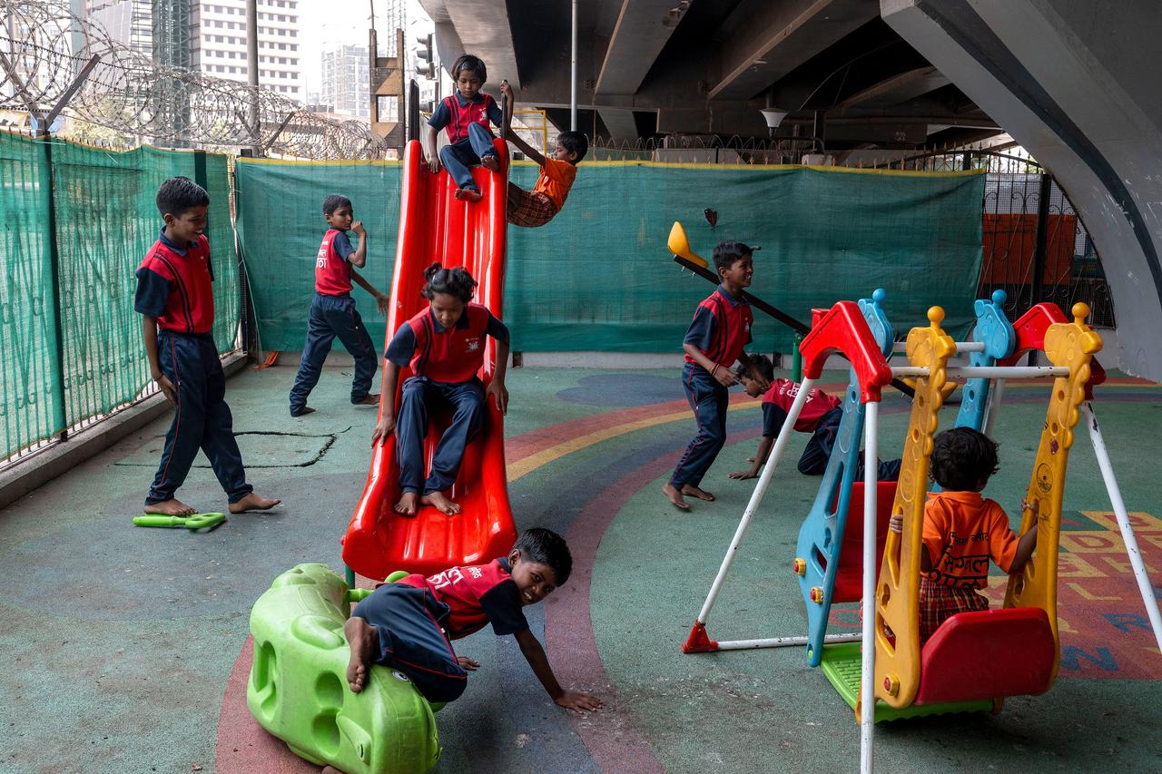 Children in a play area at the "Signal Shala", or traffic signal school, under a bridge in Mumbai, India, May 18, 2026. (AFP Photo)
