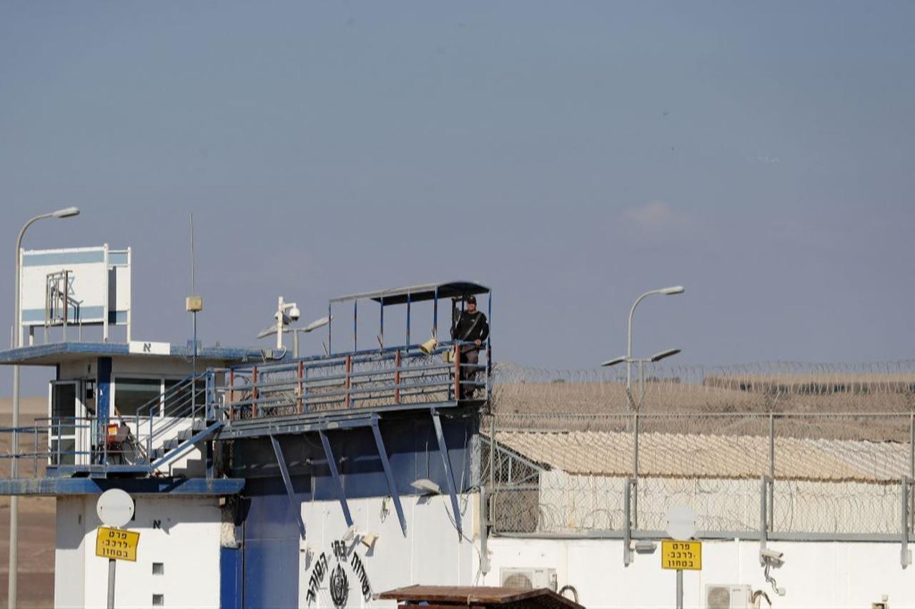 A member of the Israeli security forces stands guard at the Gilboa prison in northern Israel on September 18, 2021. (AFP Photo)
