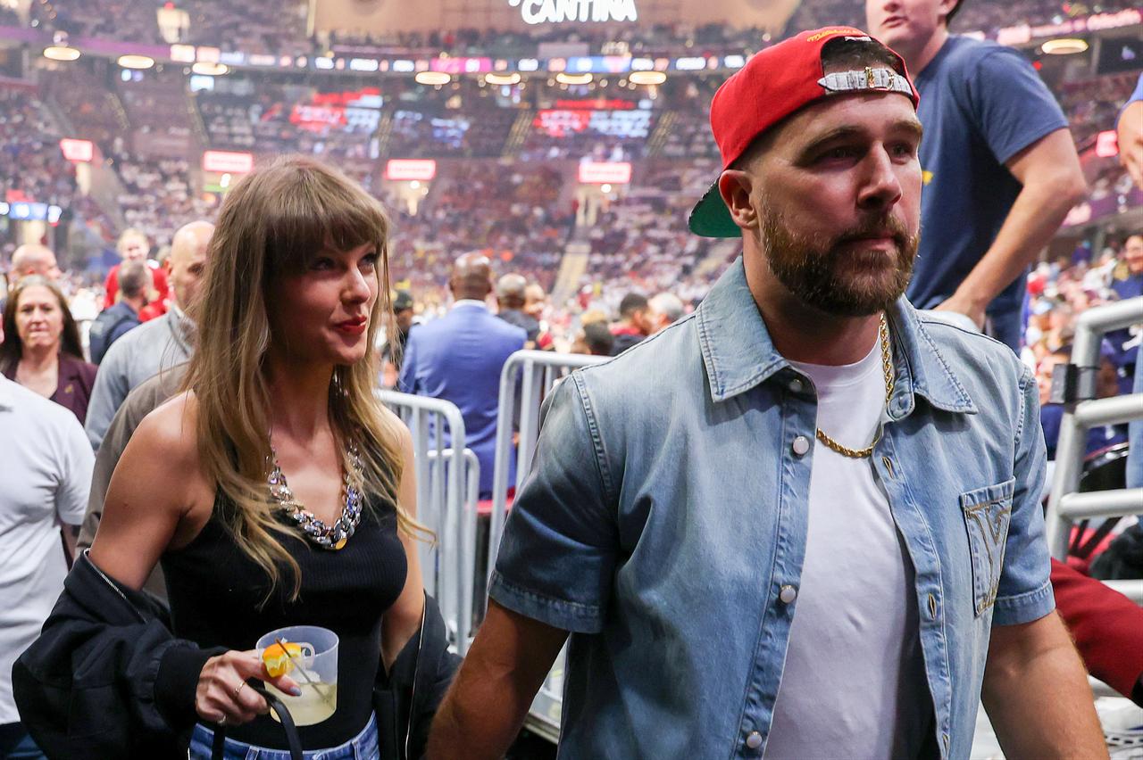 Taylor Swift and Travis Kelce attend the game between the New York Knicks and Cleveland Cavaliers at Rocket Arena in Ohio, United States, on May 23, 2026. (AFP Photo)