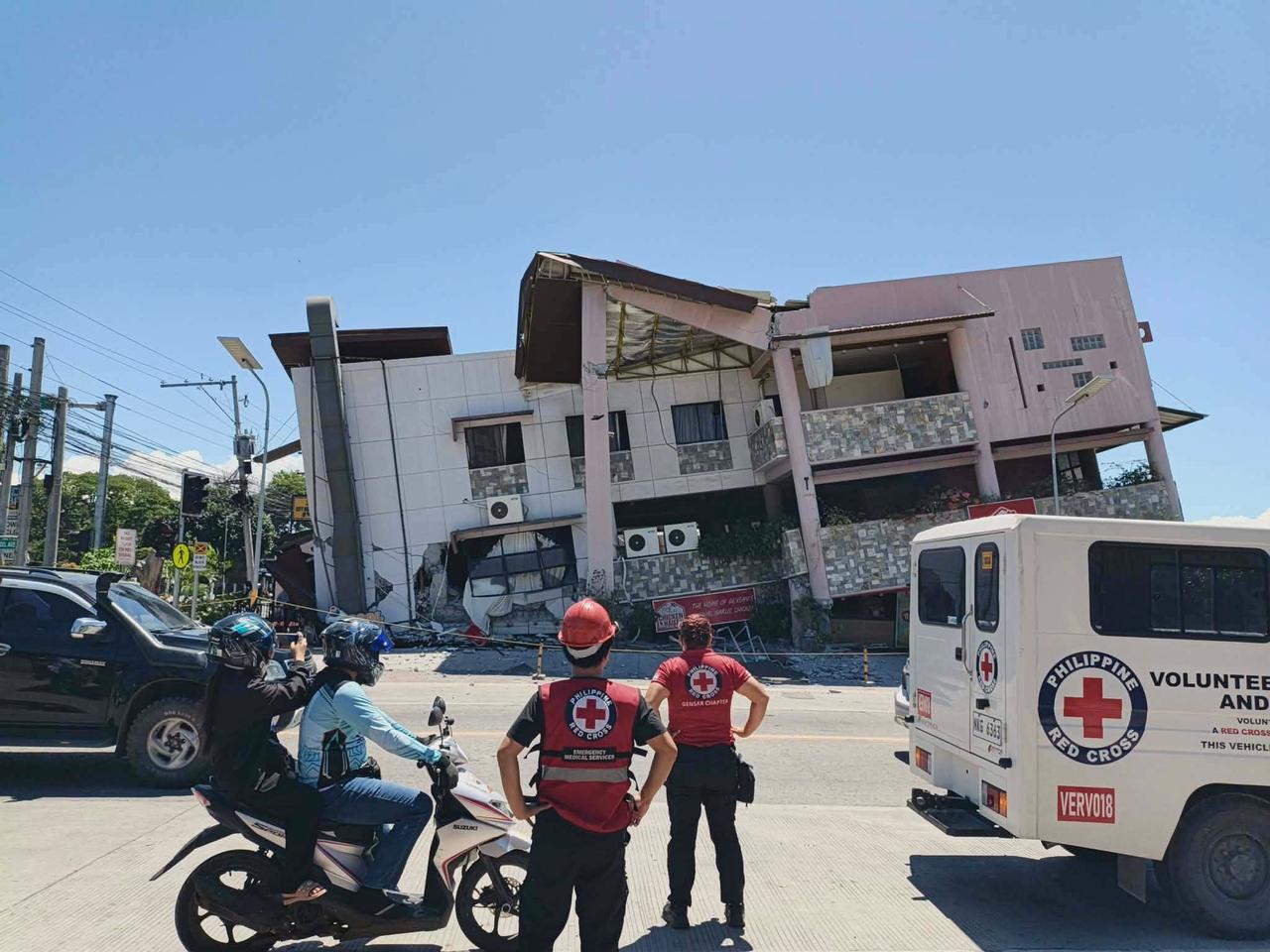 Philippine Red Cross personnel assess a damaged building following a magnitude 8.2 earthquake in Mindanao, Philippines, on June 8, 2026. (Photo via Philippine Red Cross/Handout)