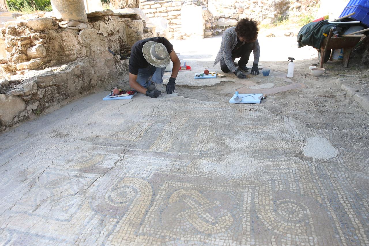 Archaeologists work on a mosaic floor at Stratonikeia Ancient City in Muğla, Türkiye, June 8, 2026. (AA Photo)