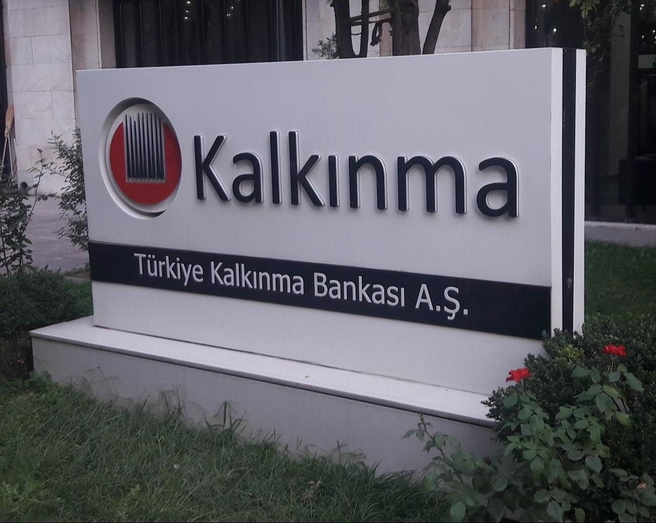 A sign for Türkiye Development and Investment Bank (TKYB) is seen outside the lender's headquarters in Istanbul, Türkiye. (Photo via Wikimedia Commons)