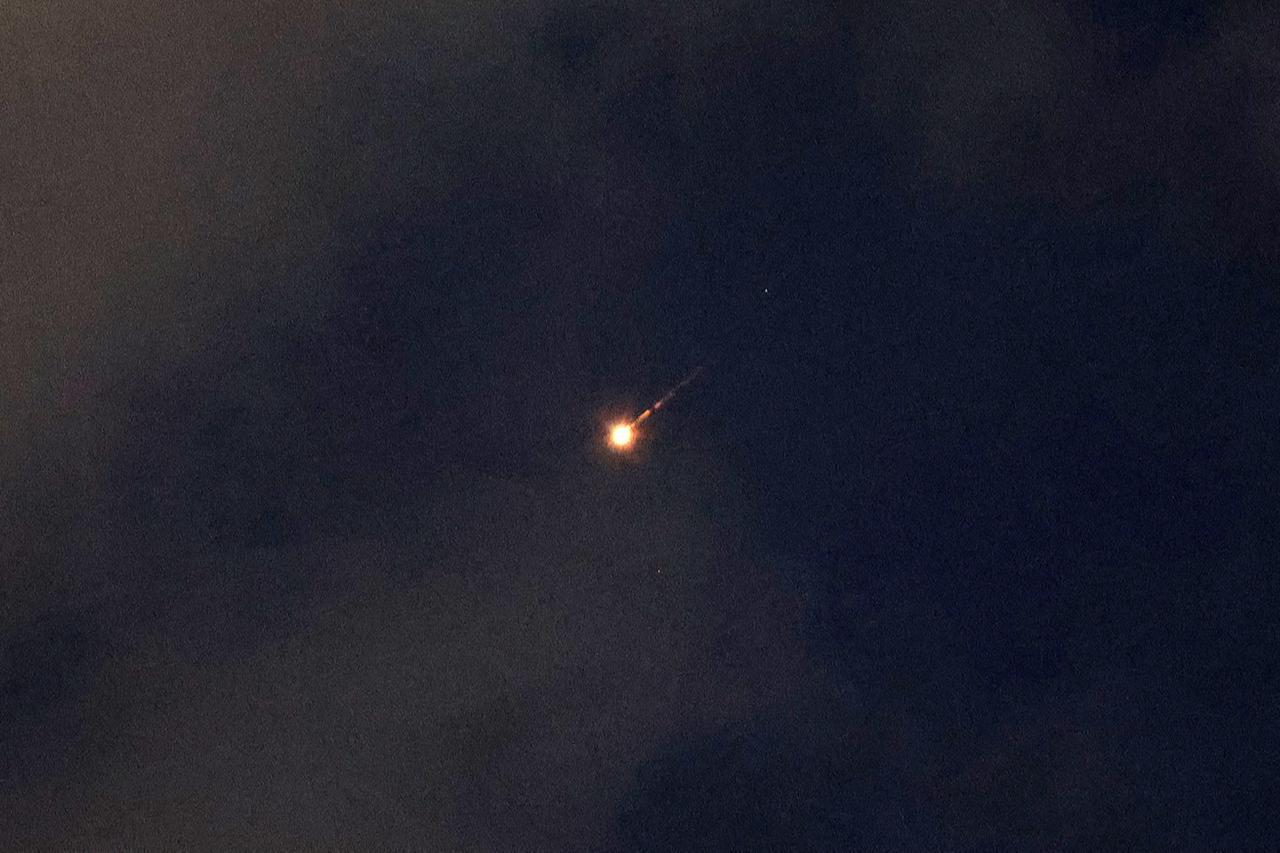 A rocket trail is seen in the sky above the Israeli coastal city of Netanya on June 7, 2026. (AFP Photo)