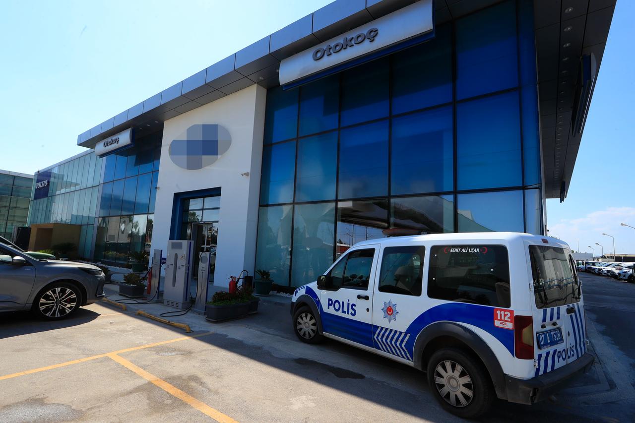 A police vehicle is parked outside an Otokoc facility after gunmen opened fire on the Koc Holding-linked business, Antalya, Türkiye, June 7, 2026. (IHA Photo)