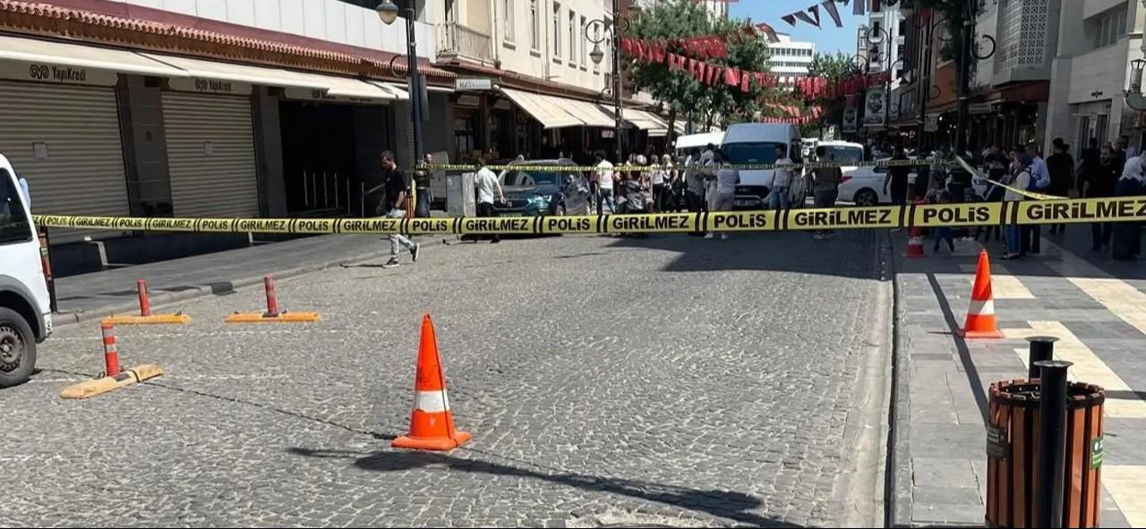 Police tape blocks access to a street as investigators examine the scene outside a Yapi Kredi Bank branch targeted in a gunfire attack, Diyarbakir, Türkiye, June 8, 2026. (IHA Photo)