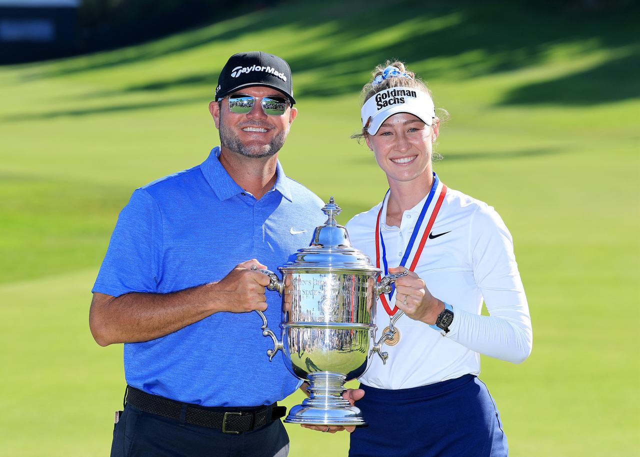 Nelly Korda poses with the trophy and her caddie Jason McDede after her one shot victory during the final round of the U.S. Women's Open. (AFP Photo)