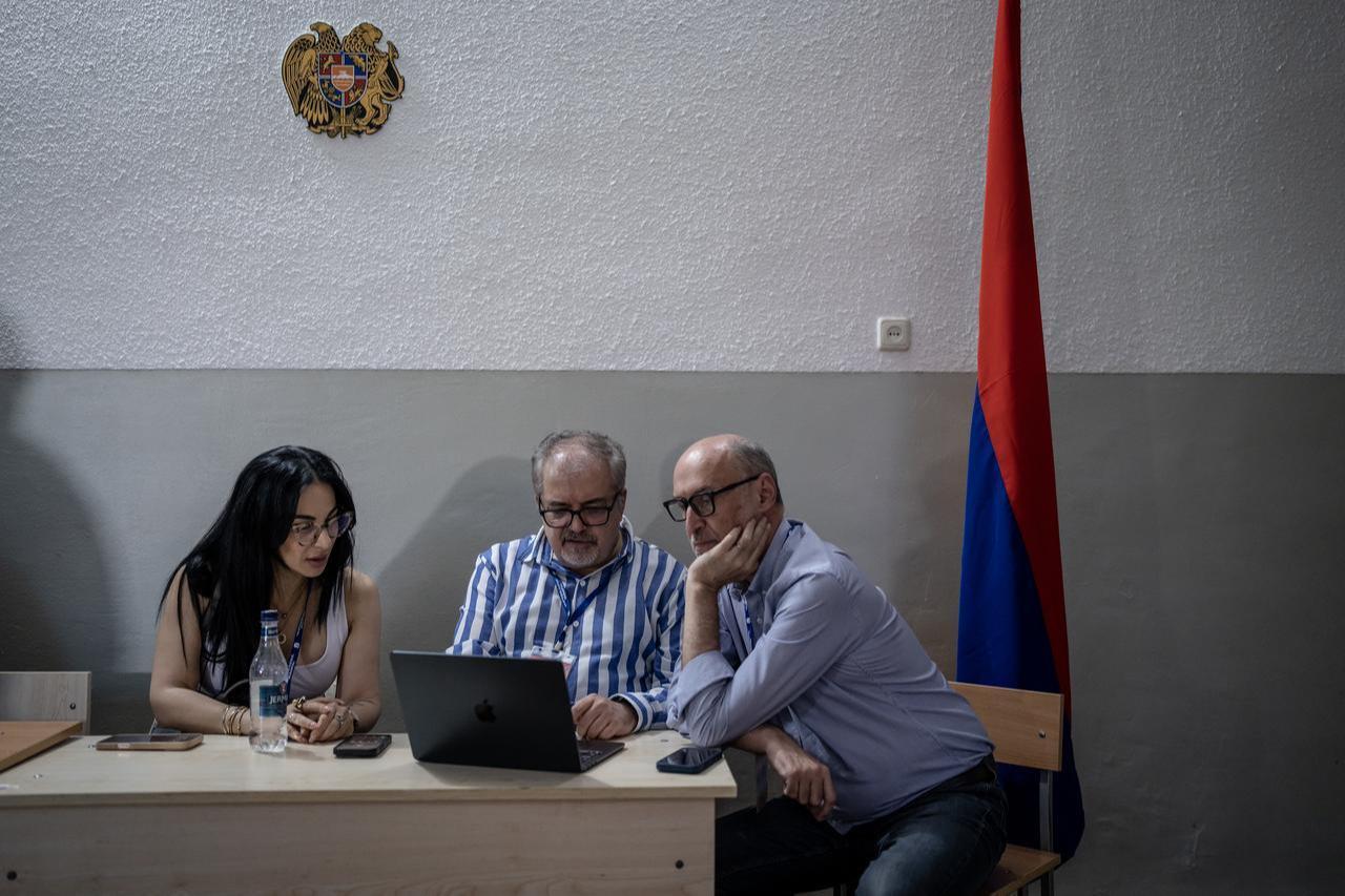 Election officials count ballots after voting concluded in the parliamentary elections in Yerevan, Armenia, on June 7, 2026. (AA Photo)