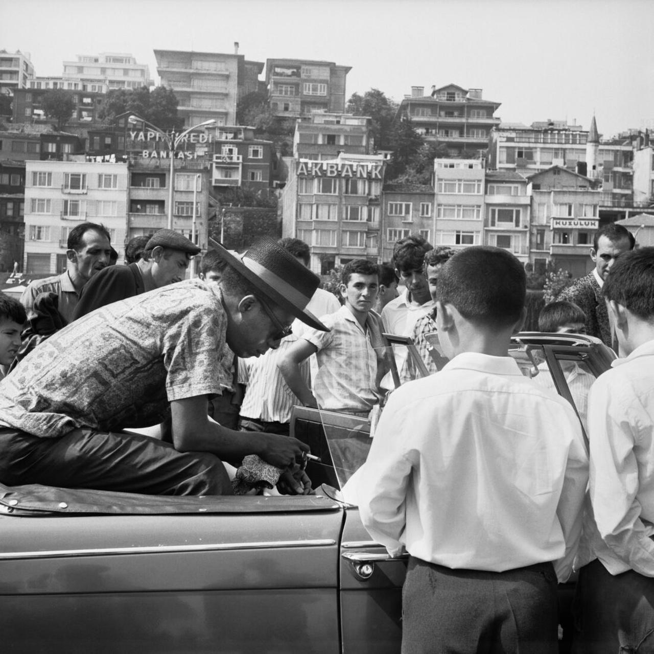 James Baldwin sitting in a Triumph Herald on the Bosporus Ferry, 1965. (Courtesy Brooklyn Public Library photo)