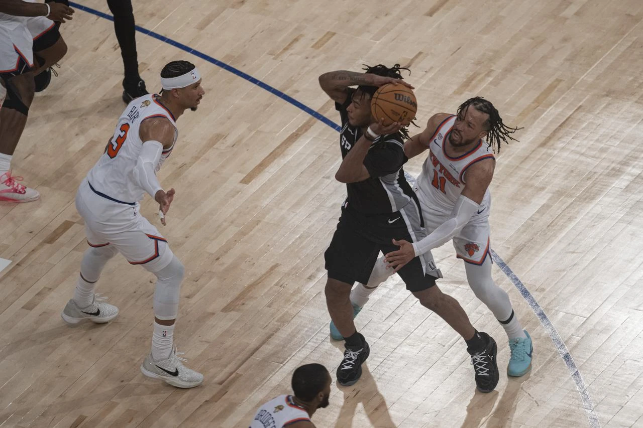 Jalen Brunson (11) of the New York Knicks and Devin Vassell (24) of San Antonio Spurs in action during the National Basketball Association (NBA) finals game between the New York Knicks and San Antonio Spurs at the Madison Square Garden in New York, United States, June 8, 2026. (AA Photo)