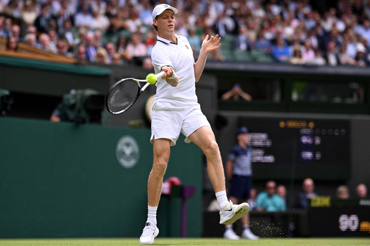 Italy's Jannik Sinner returns against Portugal's Nuno Borges on the third day of the 2026 Wimbledon Championships at The All England Lawn Tennis and Croquet Club in Wimbledon, southwest London, on July 1, 2026. (AFP Photo)