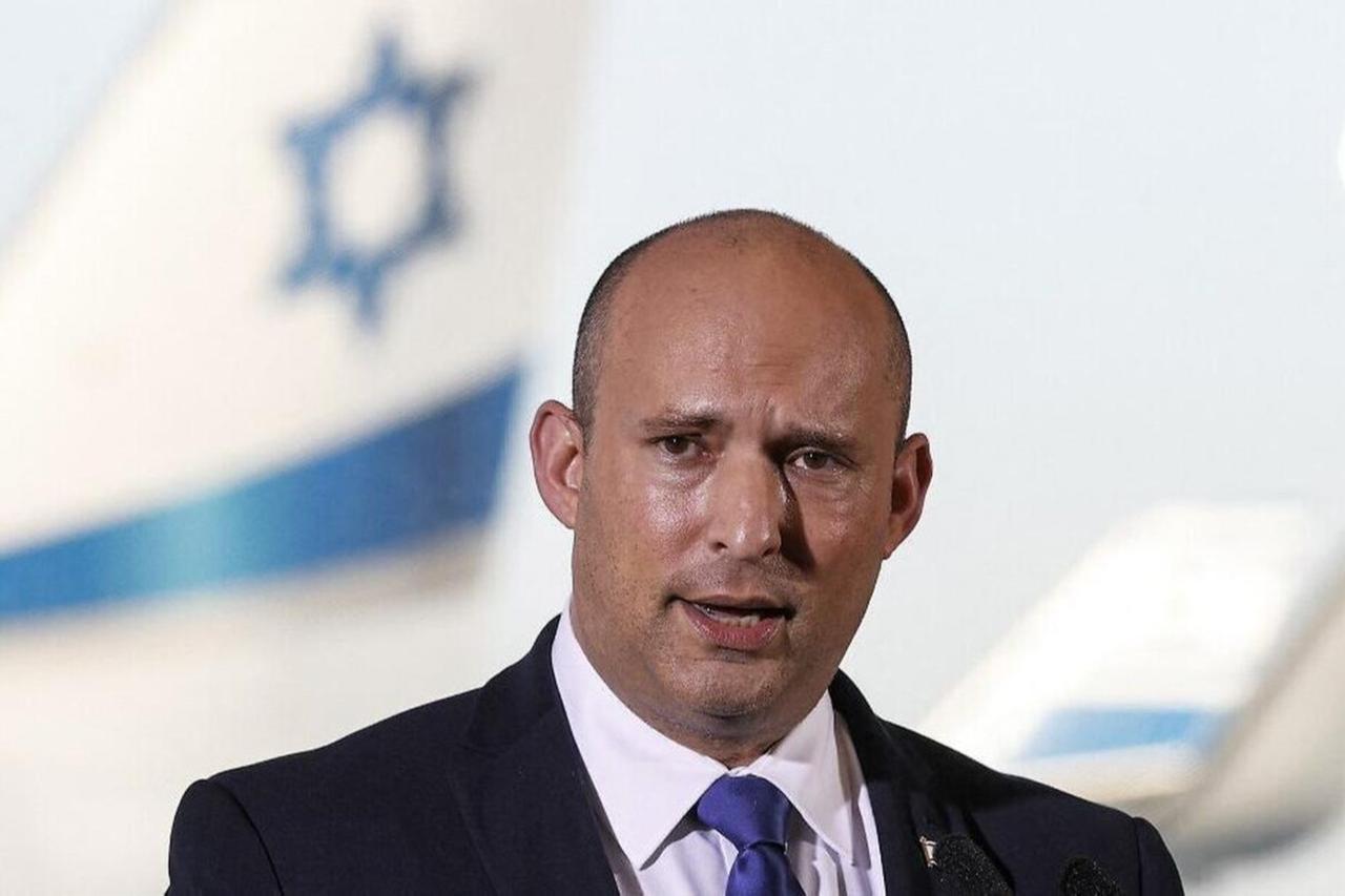 Former Israeli Prime Minister Naftali Bennett addresses reporters at Ben Gurion International Airport, June 22, 2021. (AFP Photo)