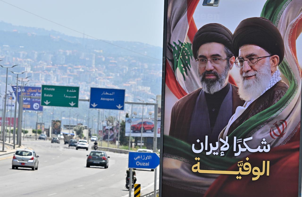 Billboards featuring the late former Iranian leader Ali Khamenei and his son Mojtaba Khamenei, who were killed in U.S. and Israeli attacks against Iran on February 28, are displayed on the Rafic Hariri International Airport highway with the text reading "Thank you, loyal Iran" in Beirut, Lebanon on June 21, 2026. (AA Photo)
