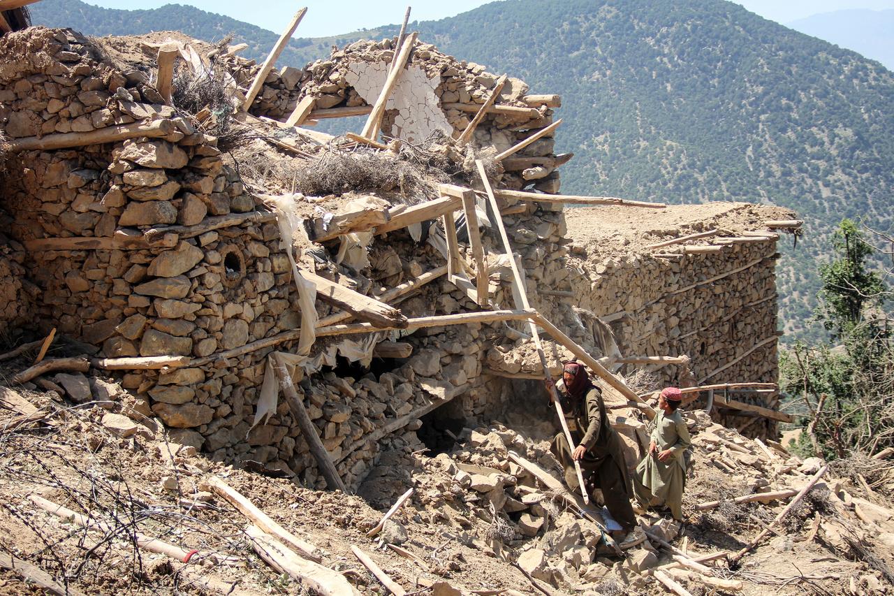 Afghan residents clear rubble from their homes at the site of a Pakistani airstrike in Barolo village in the Marawara district of Afghanistan's Kunar province, June 29, 2026. (AFP Photo)