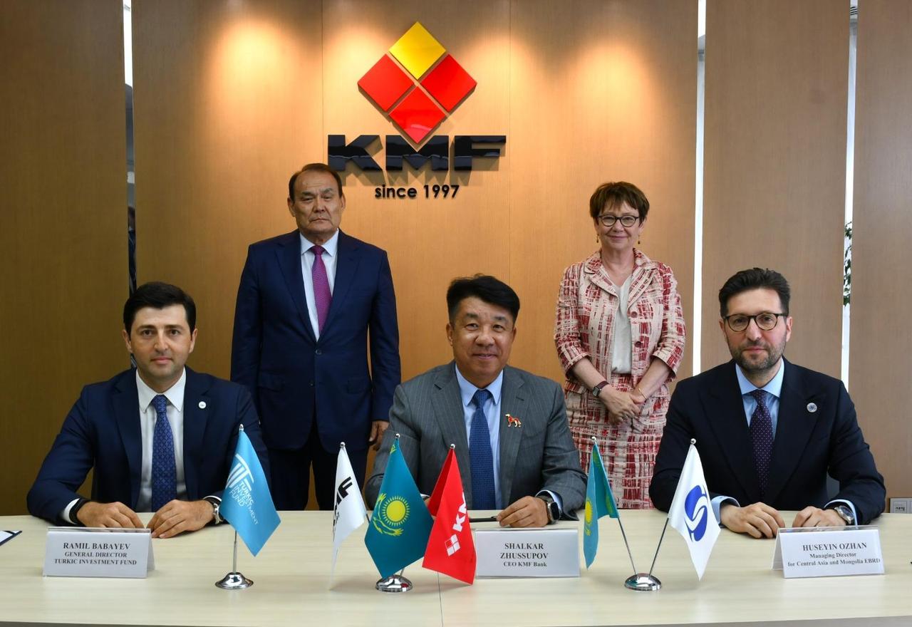 Representatives of the Turkic Investment Fund (TIF), KMF Bank and the European Bank for Reconstruction and Development (EBRD) pose after signing a $10 million loan agreement at KMF Bank's headquarters in Kazakhstan. (Courtesy of KMF Bank)