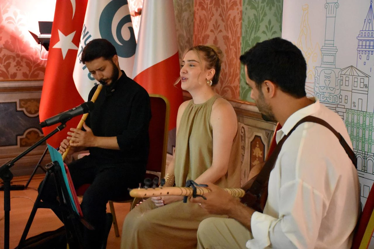 Ney player Seyfullah Ozbayrak, vocalist Ruveyda Sultan Kol and baglama musician Mucahit Kol perform during the “Bir Tel, Bir Ses, Bir Nefes” concert at the Yunus Emre Institute’s Rome Turkish Cultural Center in Rome, Italy. (AA Photo)