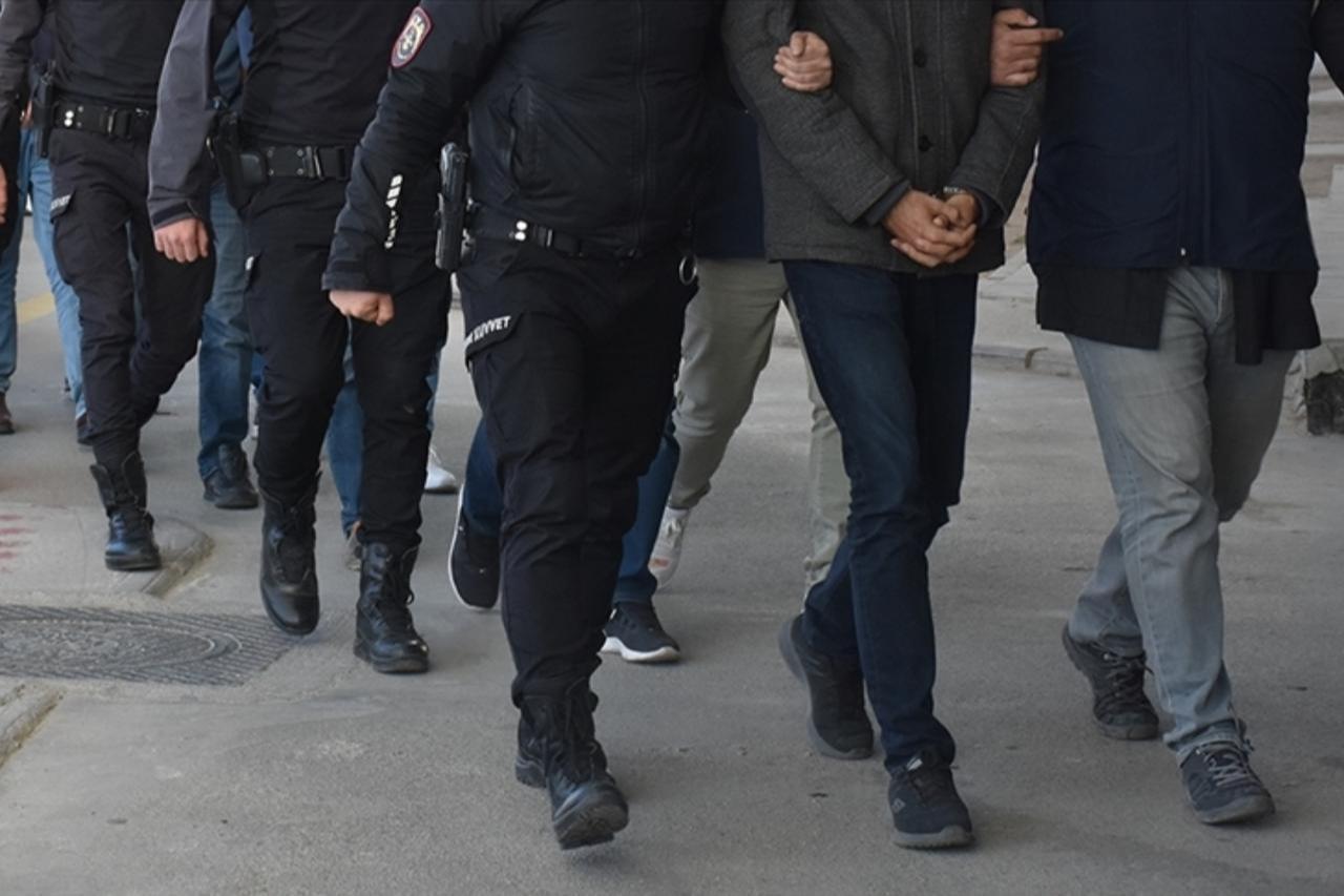 File photo shows police officers escorting suspects during an operation in Türkiye. (AA Photo)