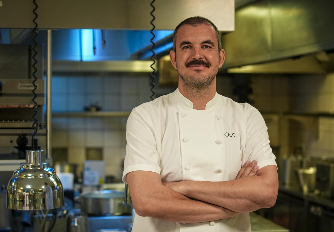 Chef Osman Sezener poses in the kitchen of his own restaurant after sharing details of the regional Turkish dishes prepared for international guests at the 36th NATO Summit in Ankara, Türkiye, July 9, 2026. (AA Photo)