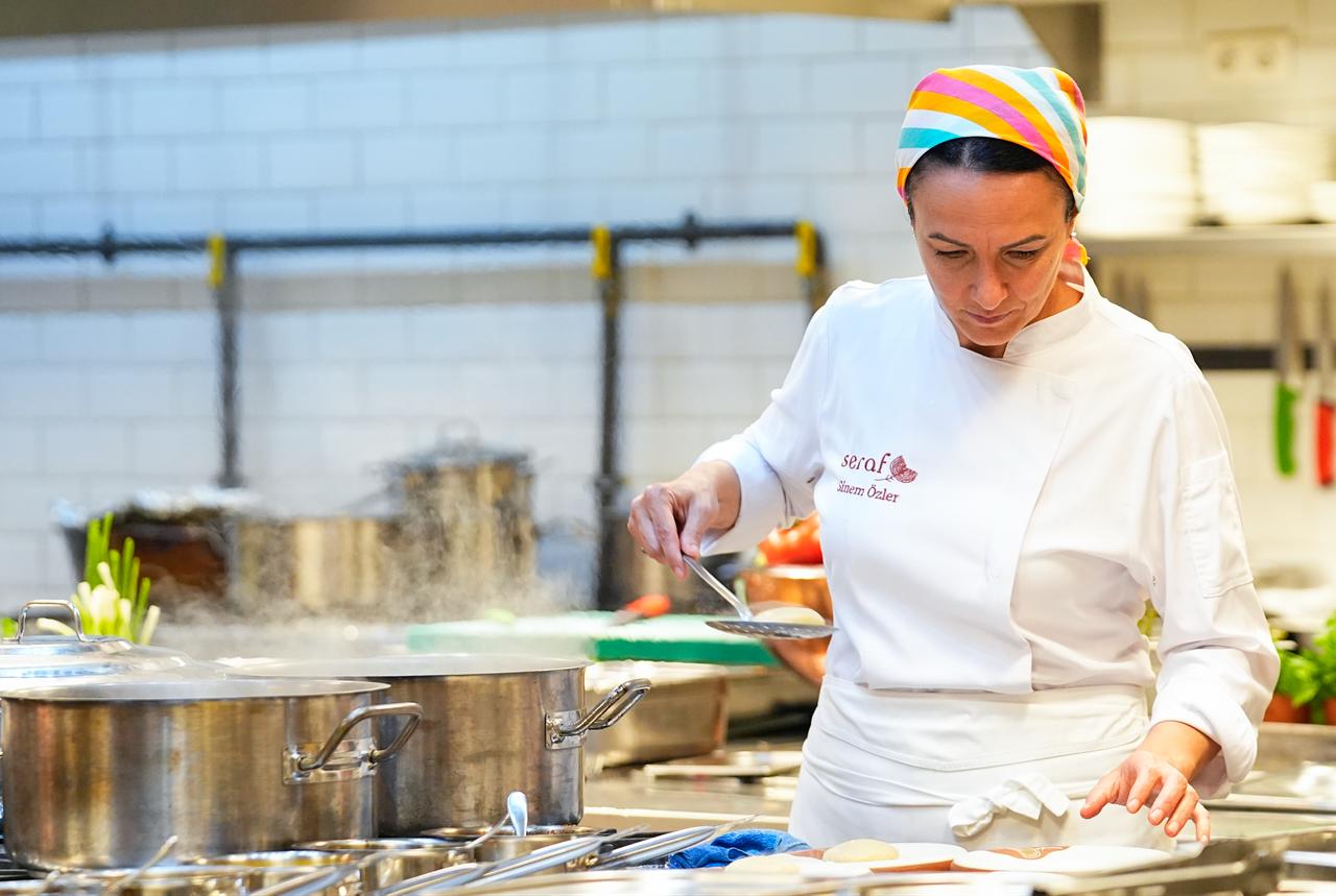 Chef Sinem Ozler works in the kitchen of her own restaurant after describing her role as the only female chef among three selected for the official banquet menu at the 36th NATO Summit in Ankara, Türkiye, July 9, 2026. (AA Photo)