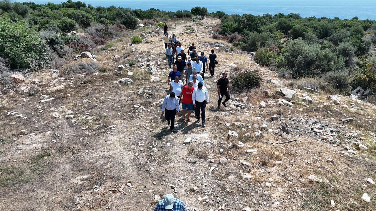 Local officials walk along the Roman Road after cleanup work in Mersin's Erdemli district, Türkiye. (AA Photo)
