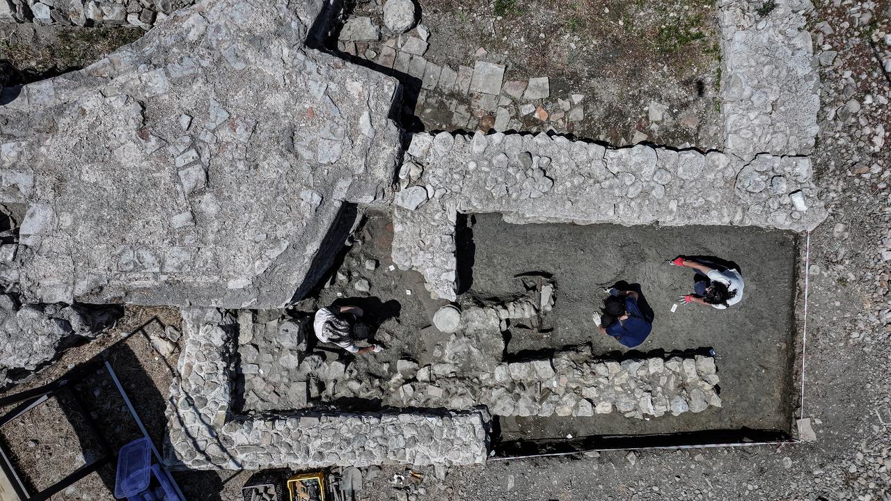 Excavation team members examine wall and floor remains uncovered at the Iznik basilica site, associated with the small church where the First Council gathered in 325, Bursa, Türkiye, July 10, 2026. (AA Photo)