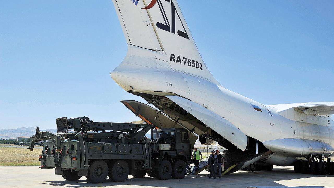 Parts of a Russian S-400 missile defense system are unloaded from a Russian plane at Murted Airport, known as Akinci Air Base, near Ankara, July 12, 2019. (HO/Turkish Defense Ministry)