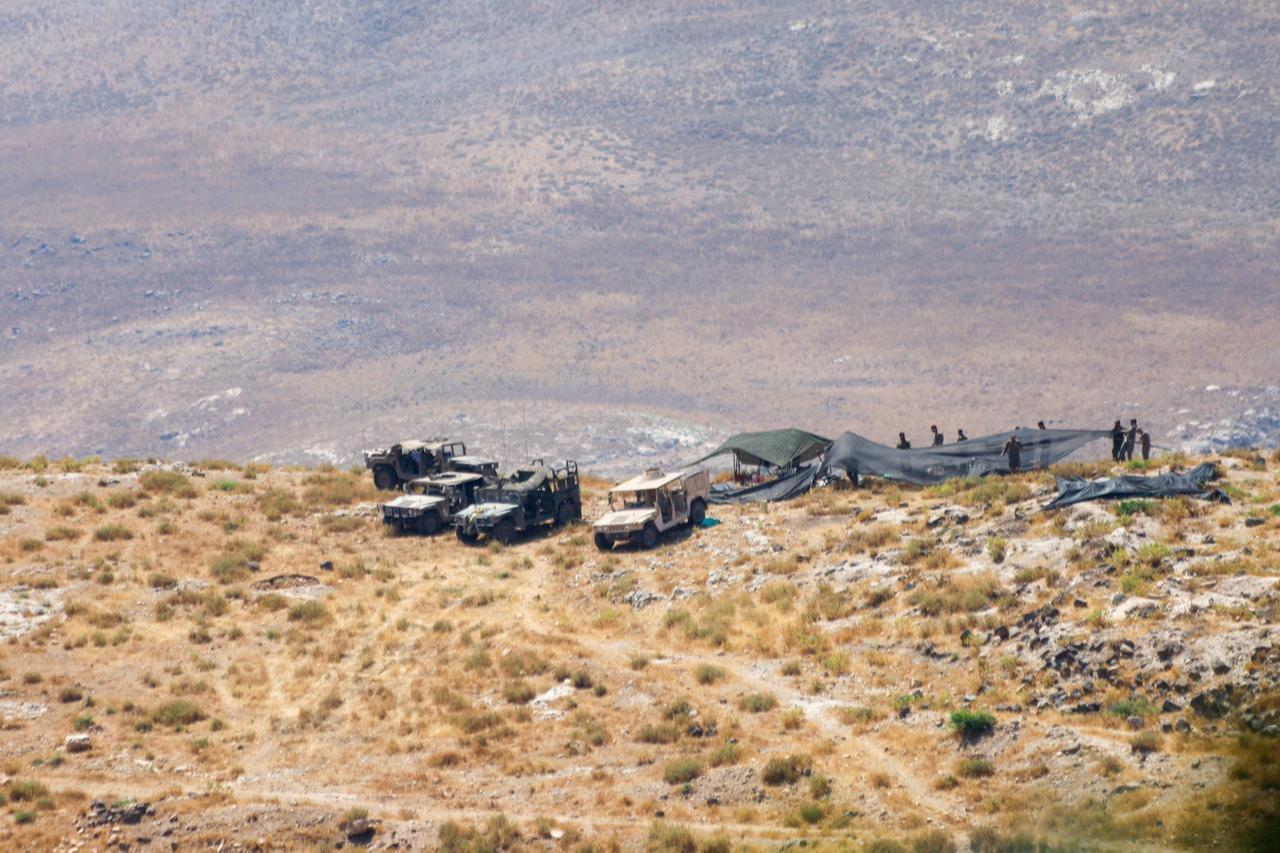 Elements of the Israeli military camp with armored vehicles in the western countryside of the Daraa Governorate in southern Syria, June 28, 2026. (AA Photo)