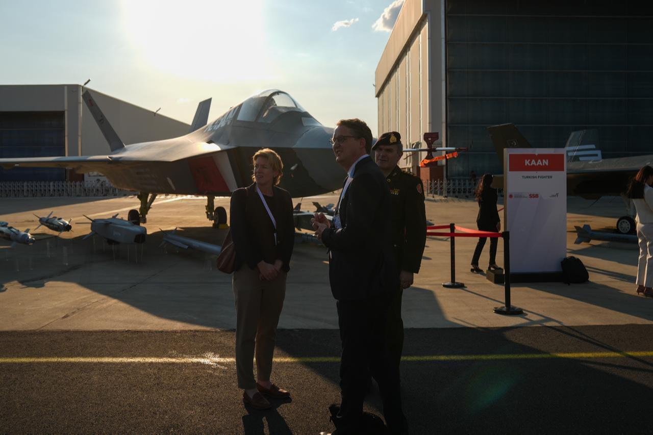 KAAN fighter jet seen in the background as summit participants attend NATO Summit Defense Industry Forum 2026 Reception, at the Turkish Aerospace Industries (TAI) campus in Ankara, July 7, 2026. (AA Photo)