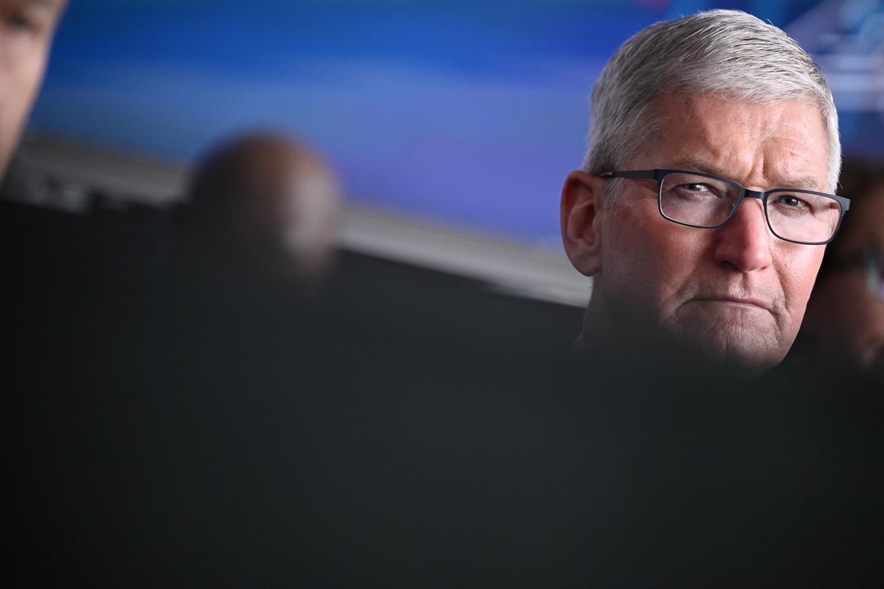 Apple CEO Tim Cook listens to US President Joe Biden deliver speech, on December 6, 2022. (AFP Photo)