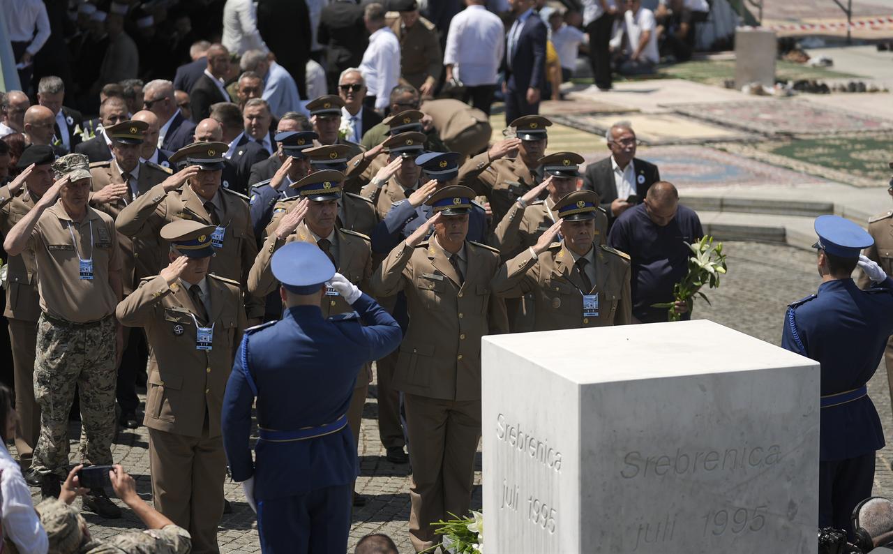 Clergy members and military representatives pay tribute at the memorial monument during a ceremony marking the 31st anniversary of the 1995 Srebrenica genocide at the Potocari Memorial Cemetery in Potocari, Bosnia and Herzegovina, July 11, 2026. (AA Photo)